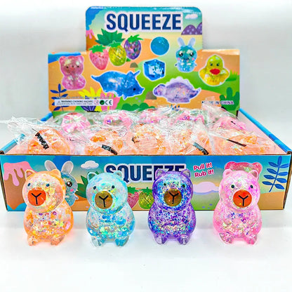 Squishy capybara gummy pailleté anti-stress, les quatre coloris rose, bleu, violet et orange