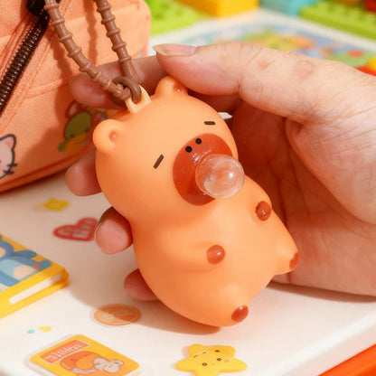 Squishy capybara porte-clés anti-stress orange qui souffle une bulle