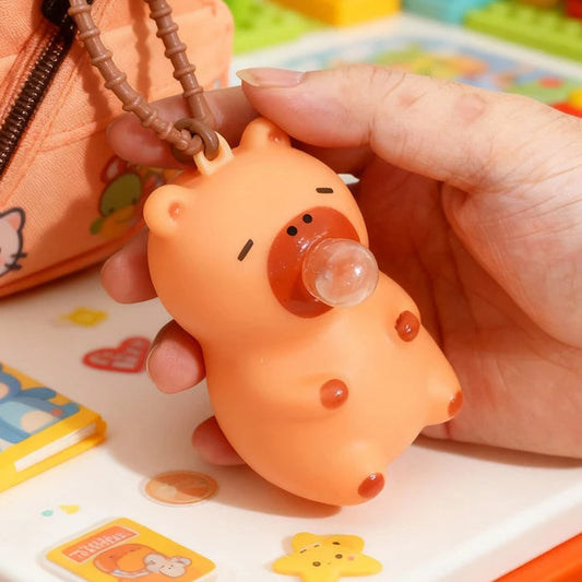Squishy capybara porte-clés anti-stress orange qui souffle une bulle